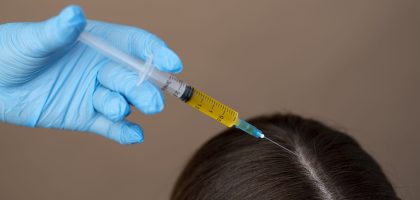 hand-giving-injection-patient-high-angle